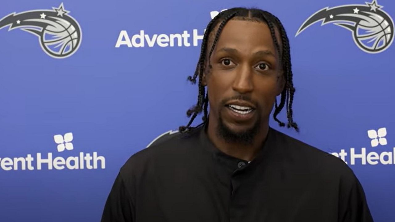 Guard Kentavious Caldwell-Pope talks with reporters and photographers in Orlando on Saturday, July 6, 2024 after signing a free-agent contract. (Spectrum Sports)