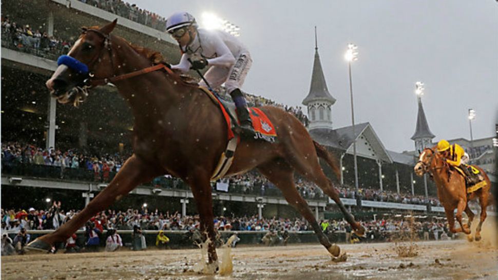 Mike Smith rides Justify to victory during the 144th running of the Kentucky Derby at Churchill Downs Saturday, May 5, 2018 in Louisville, Ky. (AP Photo/Morry Gash)