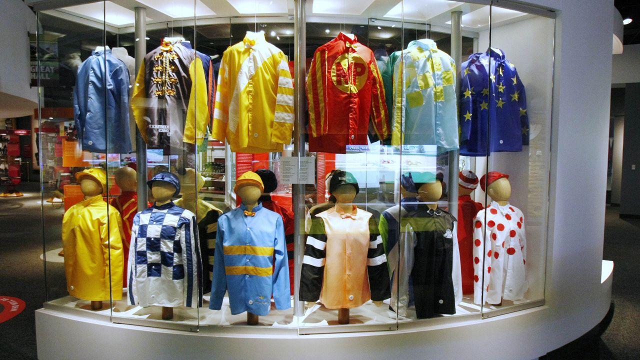FILE - This Monday, April 19, 2010 file photo shows a display of Kentucky Derby winners' silks at the Kentucky Derby Museum in Louisville, Ky.  (AP Photo/Ed Reinke)