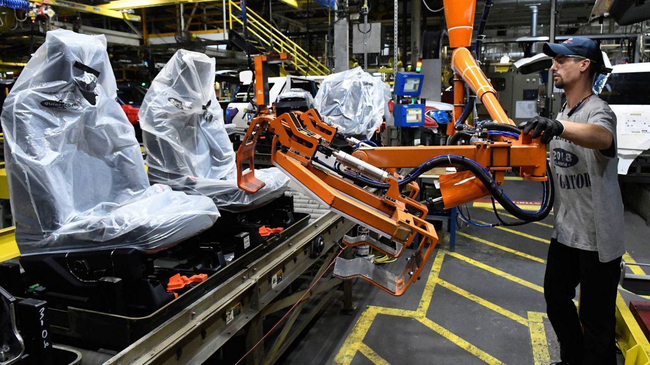 Workers assemble Ford trucks at the Ford Kentucky Truck Plant in Louisville, Ky. on Oct. 27, 2017. (AP Photo/Timothy D. Easley, File)