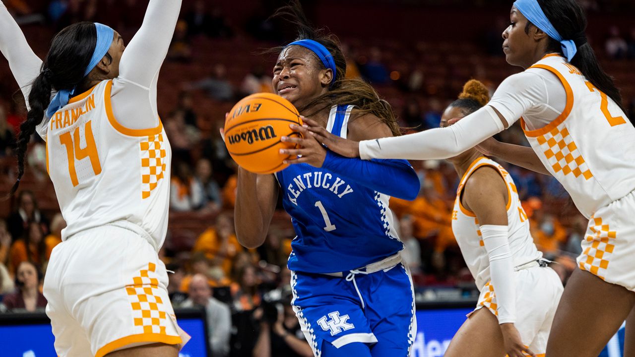 Kentucky's Robyn Benton (1) drives to the basket against the defense of Tennessee's Jasmine Franklin (14) and Rickea Jackson (2) in the second half of an NCAA college basketball game during the Southeastern Conference women's tournament in Greenville, S.C., Friday, March 3, 2023. (AP Photo/Mic Smith)