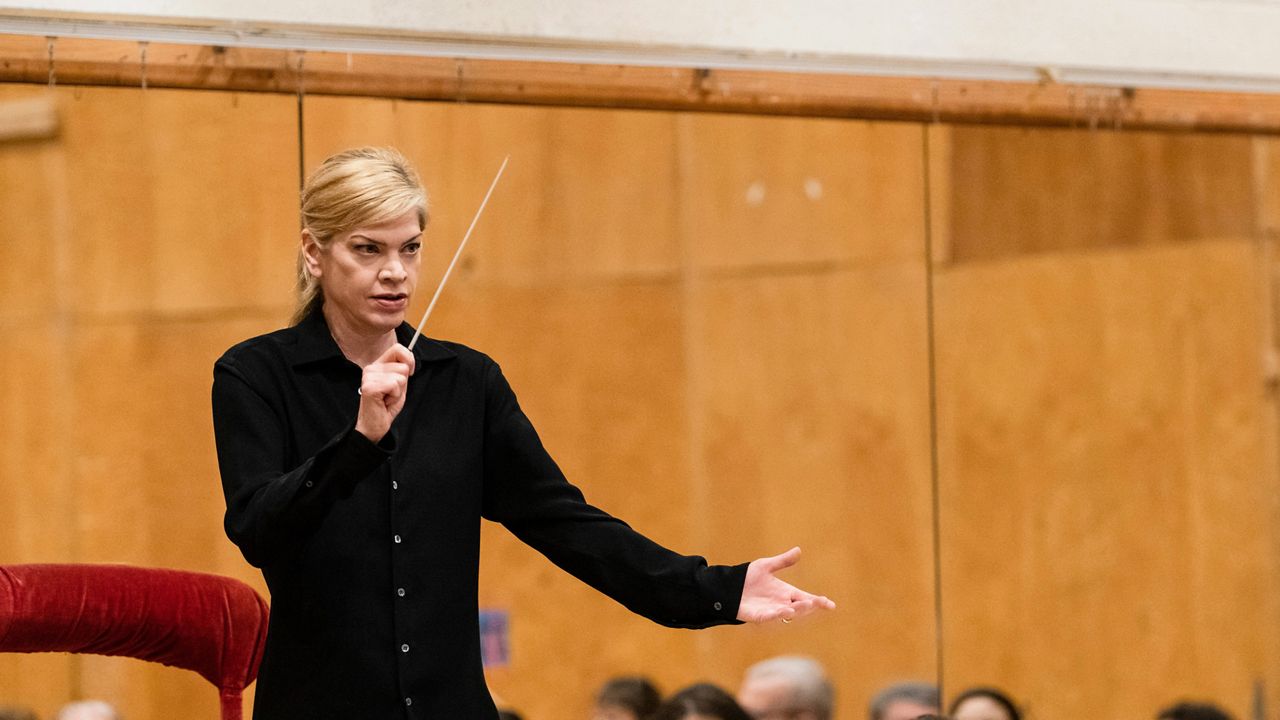 This image released by the Metropolitan Opera shows Keri-Lynn Wilson conducting a rehearsal for Shostakovich's "Lady Macbeth of Mtsensk" at the Metropolitan Opera in New York on Sept. 8, 2022.