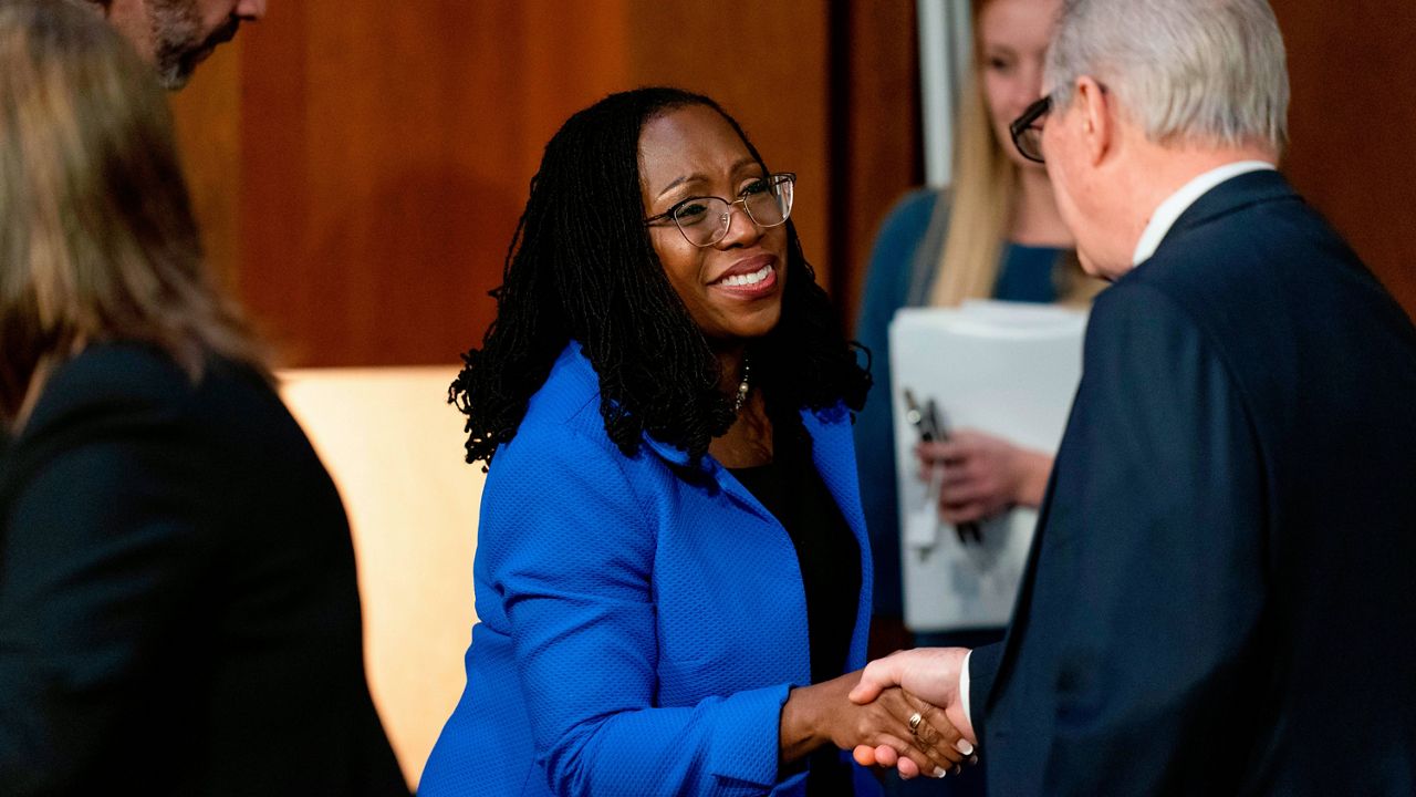 Supreme Court nominee Ketanji Brown Jackson shakes hands with Senate Judiciary Committee Chairman Sen. Dick Durbin, D-Ill., right, on Wednesday at the Capitol. (AP Photo/Andrew Harnik)