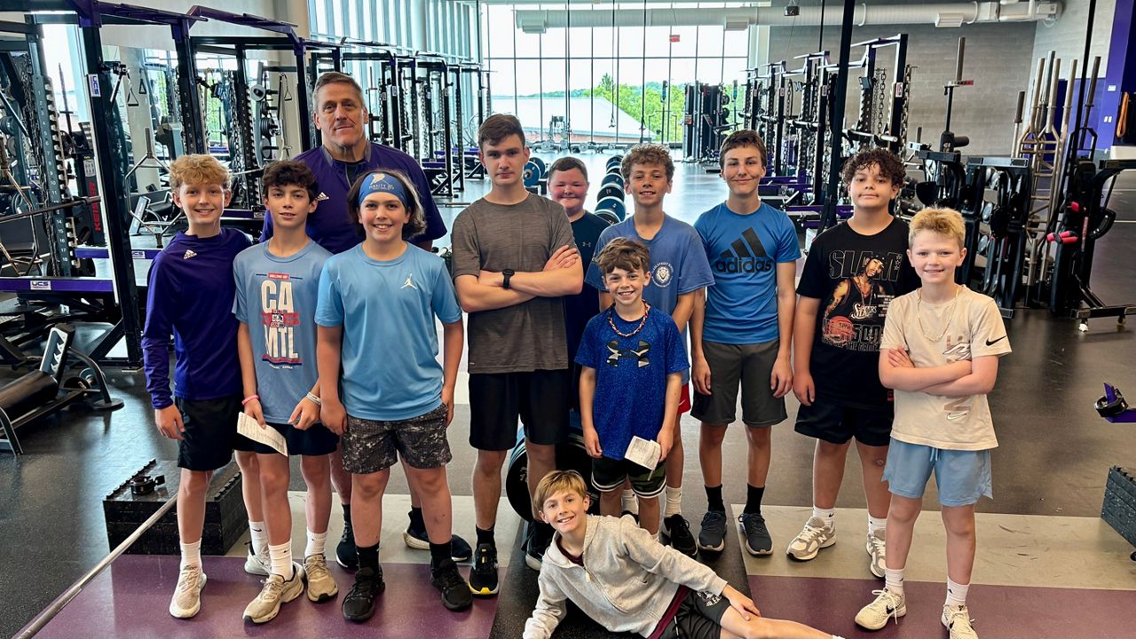 Members of Jacked on the Hill pose with Jeff Oliver (Spectrum News1/Jeff Oliver)