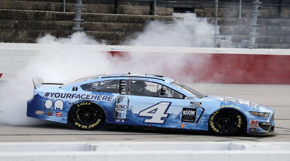Kevin Harvick does a burnout after winning the NASCAR Cup Series auto race Sunday, May 17, 2020, in Darlington, S.C. (AP Photo/Brynn Anderson)