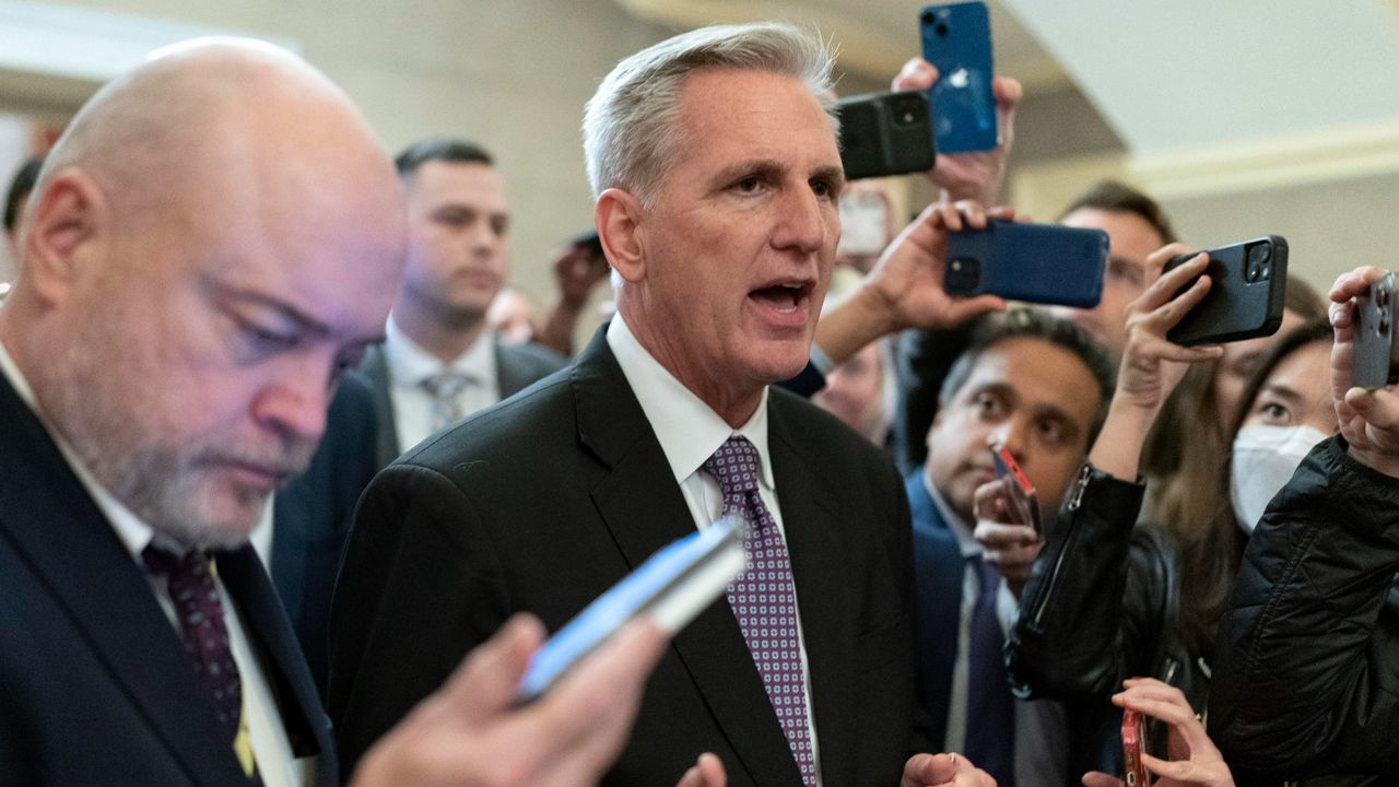 Rep. Kevin McCarthy, R-Calif., talks to reporters in the Capitol after the House voted to adjourn for the evening Wednesday. (AP Photo/Jose Luis Magana)