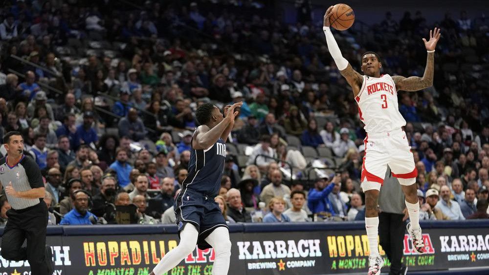 Houston Rockets guard Kevin Porter Jr. (3) steals a pass meant for Dallas Mavericks forward Dorian Finney-Smith during the first quarter of an NBA basketball game in Dallas, Wednesday, Nov. 16, 2022. (AP Photo/LM Otero)