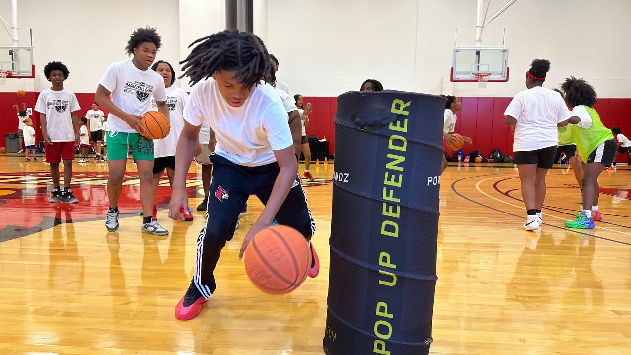 100 kids shoot hoops, learn valuable skills, at free KFC Yum! Center basketball camp