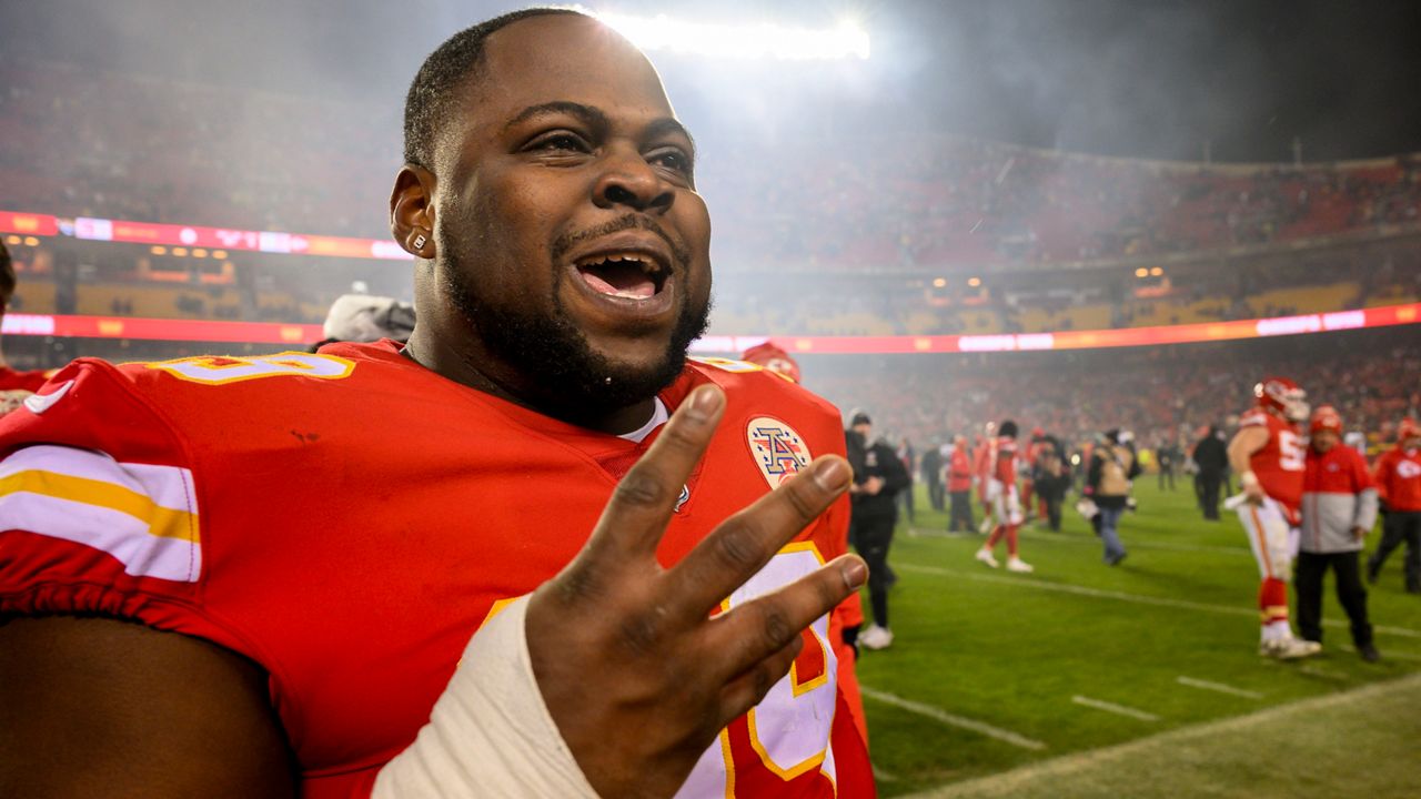 Kansas City Chiefs defensive tackle Khalen Saunders, a Parkway Central graduate, holds up four fingers and shouts that they're going to their fourth straight AFC Championship game after beating the Jacksonville Jaguars in an NFL divisional round playoff football game, Saturday, Jan. 21, 2023 in Kansas City, Mo. (AP Photo/Reed Hoffmann)