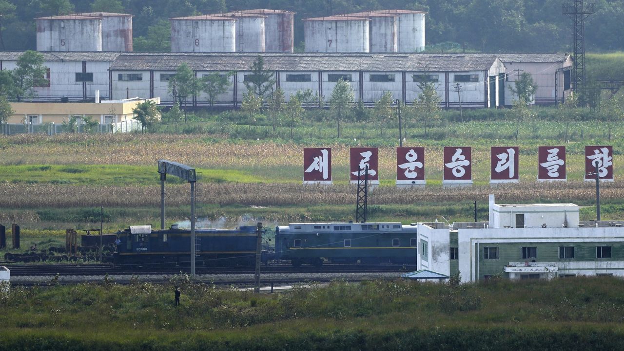 A green train with yellow trimmings, resembling one used by North Korean leader Kim Jong Un on his previous travels, is seen Monday along North Korea’s border with Russia and China. (AP Photo/Ng Han Guan)