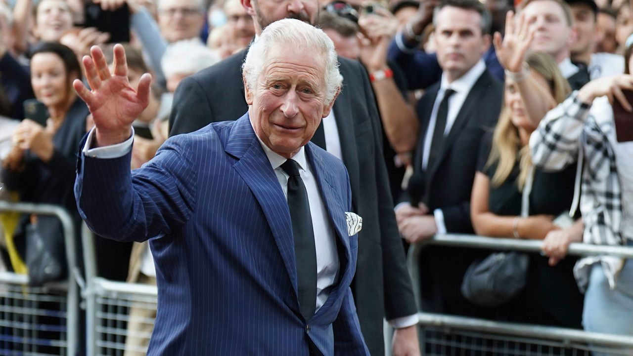 King Charles III greets members of the public outside Clarence House in London after he was formally proclaimed monarch by the Privy Council, Saturday Sept. 10, 2022. (James Manning/PA via AP)