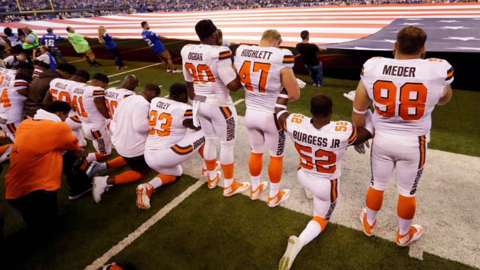 (File image of NFL players kneeling)