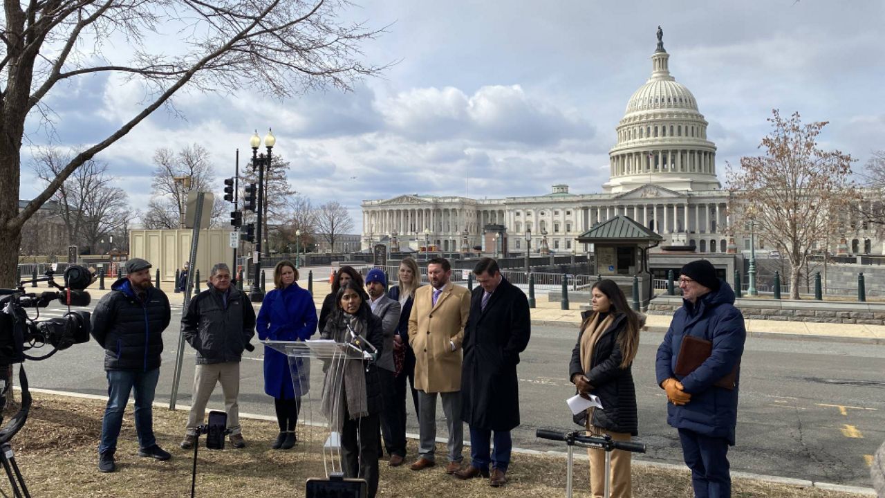 Advocates and veterans speak on Capitol Hill to call for an adjustment act from Congress that would guarantee Afghan evacuees get permanent status in the United States. (Austin Landis/Spectrum News)