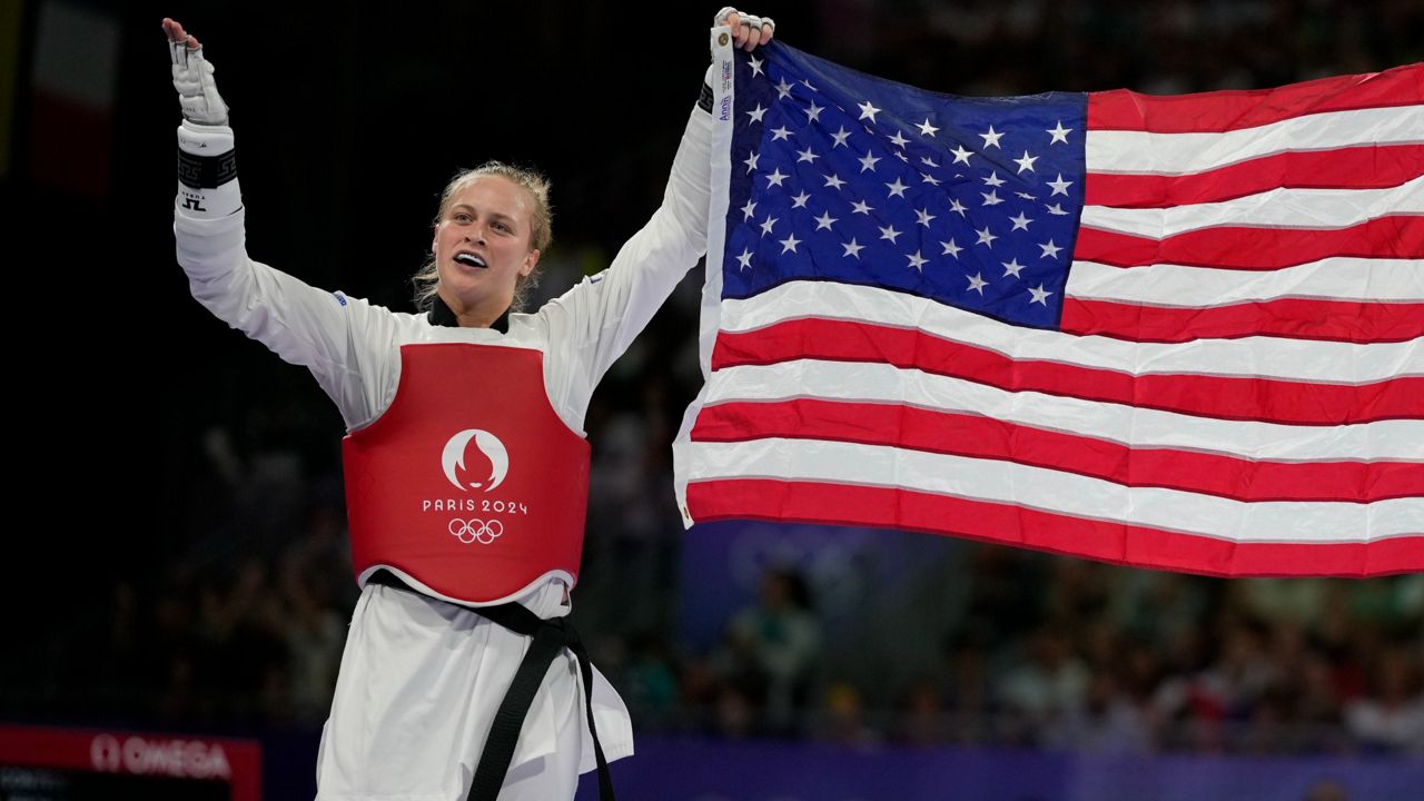 Kristina Teachout of Palm Bay celebrates after winning the women's 67-kilogram taekwondo bronze final match against China's Song Jie during the 2024 Summer Olympics, at the Grand Palais, Friday, Aug. 9, 2024, in Paris. (AP Photo/Andrew Medichini)