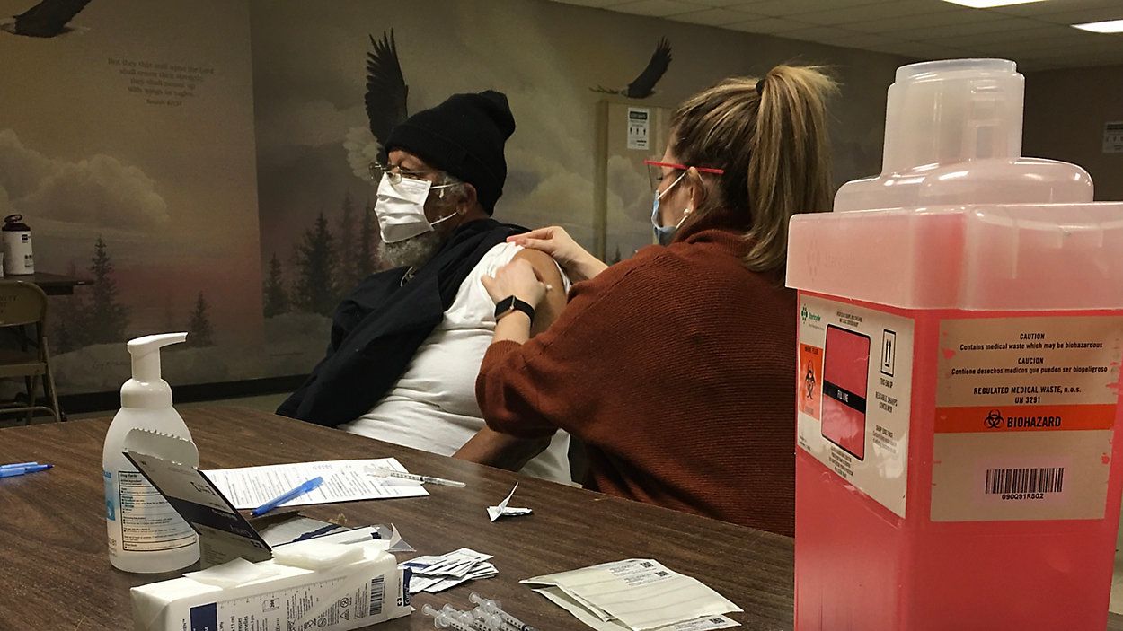 Person being given a vaccine