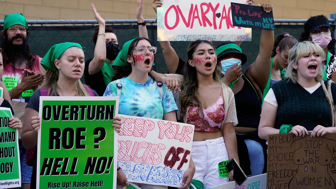 Abortion-rights activists rally outside the First Street U.S. Courthouse, Central District of California, in downtown Los Angeles, Monday, June 27, 2022. (AP Photo/Damian Dovarganes)