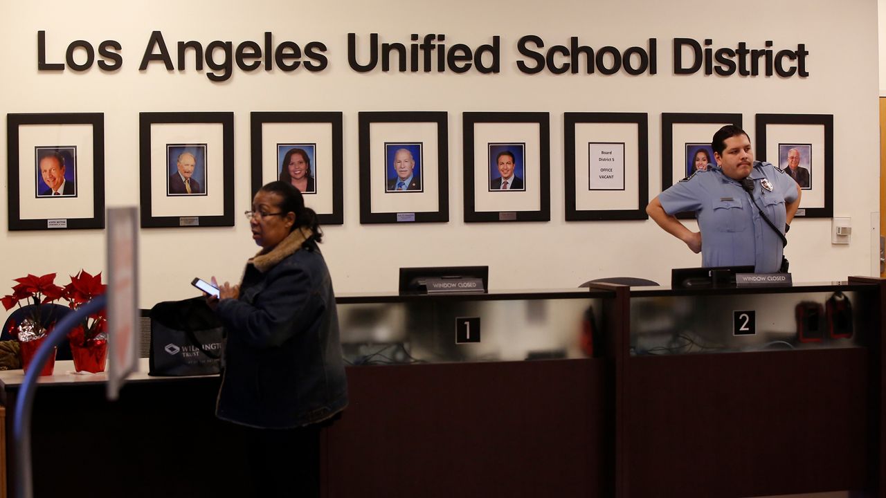 Los Angeles Unified School District Superintendent Austin Beutner, pictured far left, along with other LAUSD Board members at their headquarters lobby in Los Angeles Friday, Jan. 11, 2019. A massive teachers strike in Los Angeles is still planned for Monday, Jan. 14, after a union rejected a new offer from the nation's second-largest school district and declared an impasse following 21 months of increasingly heated negotiations. After hours of new talks Friday, the union representing teachers in the Los Angeles Unified School District announced that the new offer was "woefully inadequate." (AP Photo/Damian Dovarganes)