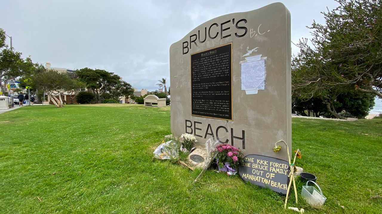 The monument plaque at Bruce's Beach park in Manhattan Beach. (Spectrum News/David Mendez)