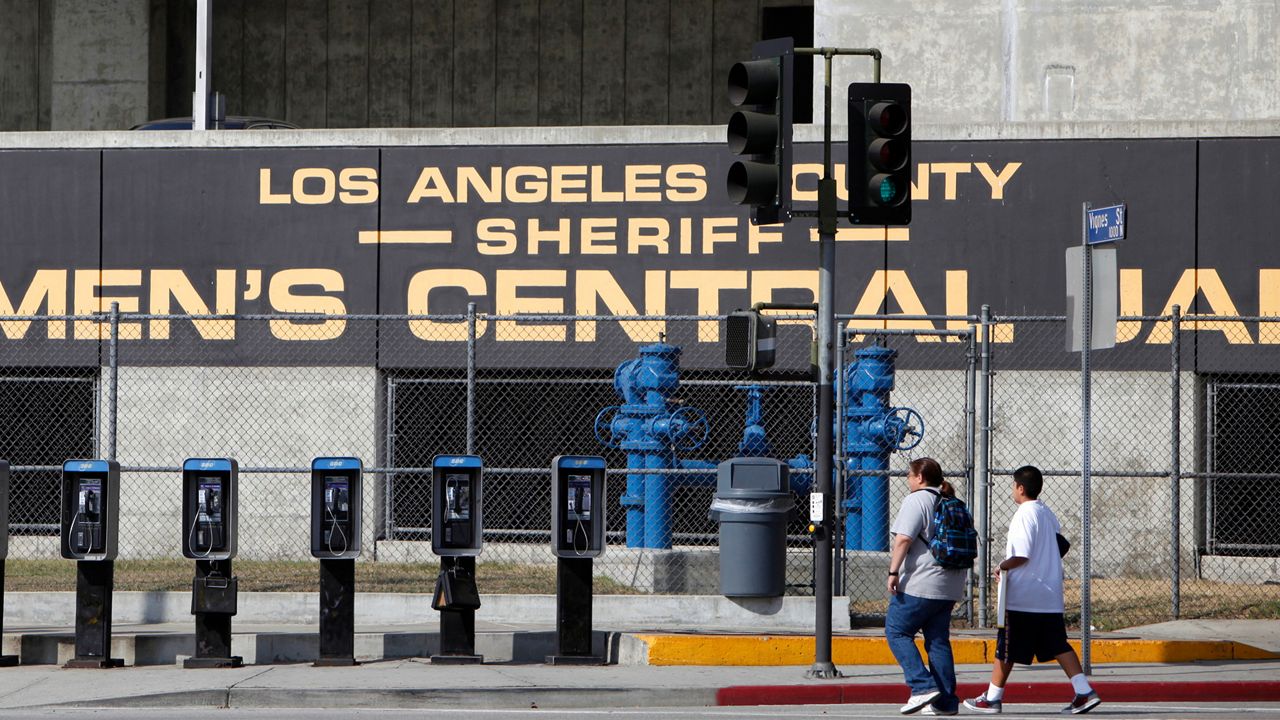  This September 28, 2011, photo shows the Los Angeles County Sheriff's Men's Central Jail facility in Los Angeles. Los Angeles County has canceled a nearly $2 billion contract to replace an aging jail after criticism that it needs better ways to deal with a growing population of the mentally ill. County supervisors on Tuesday, August 13, 2019, voted to scrap the contract to replace the Men's Central Jail with a mental health treatment center that critics said was simply another jail. (AP Photo/Damian Dovarganes, File)