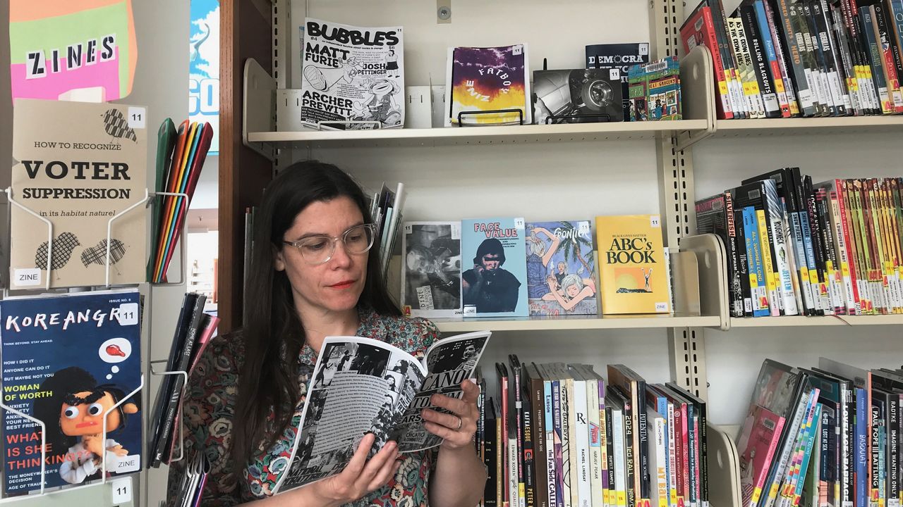 Los Angeles Public Library's Angi Brzycki reads a zine from the collection of the Frances Howard Goldwyn — Hollywood Regional Library. (Photo courtesy Los Angeles Public Library)