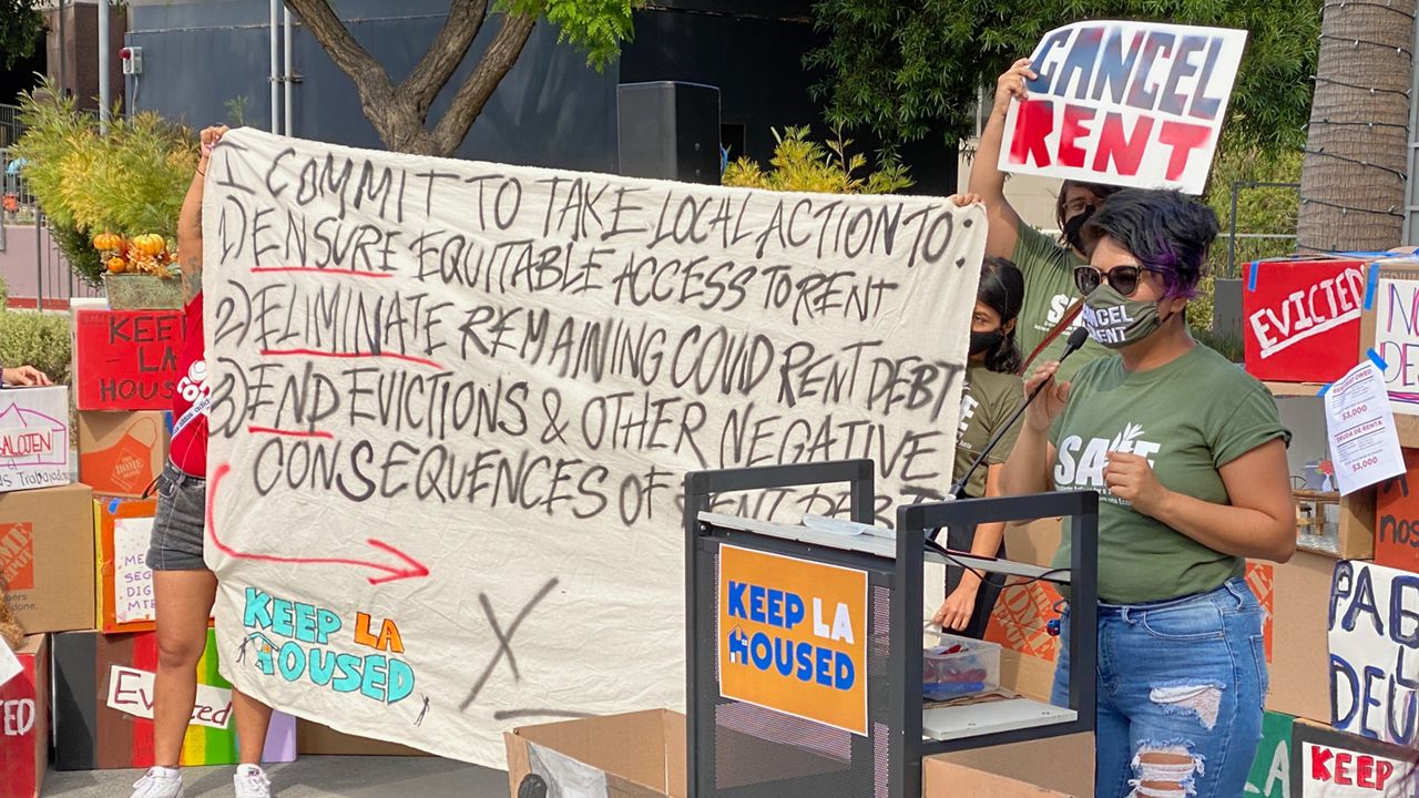 Strategic Actions for a Just Economy organizer Edna Monroy speaks at a rally at Los Angeles' Grand Park. (Spectrum News 1/David Mendez)