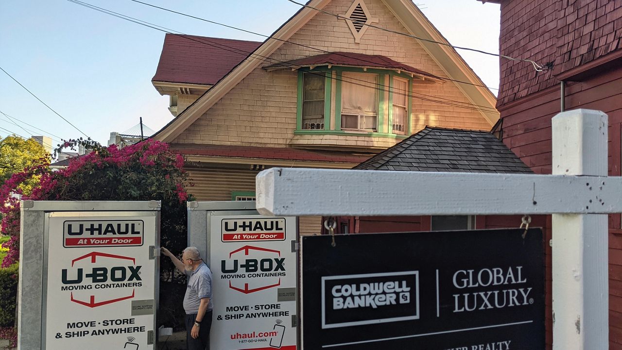 A Los Angeles man prepares to leave California after selling his Echo Park home. (AP Photo/Damian Dovarganes)