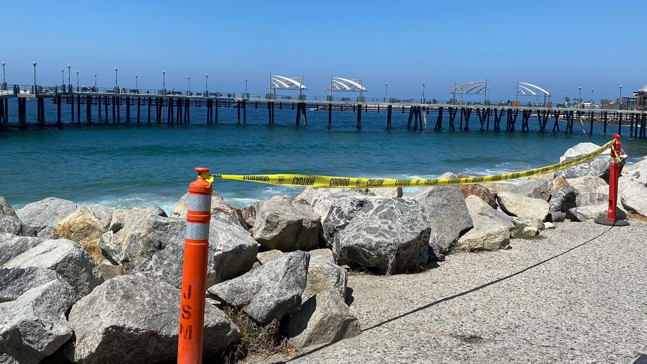 Caution tape lines the site of a police shooting at the Redondo Pier on Aug. 26. (Spectrum News/David Mendez)