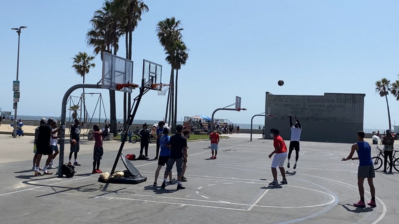 A three-on-three "protest game" to unlock the hoops at Venice Beach on May 2. (Spectrum News/David Mendez)