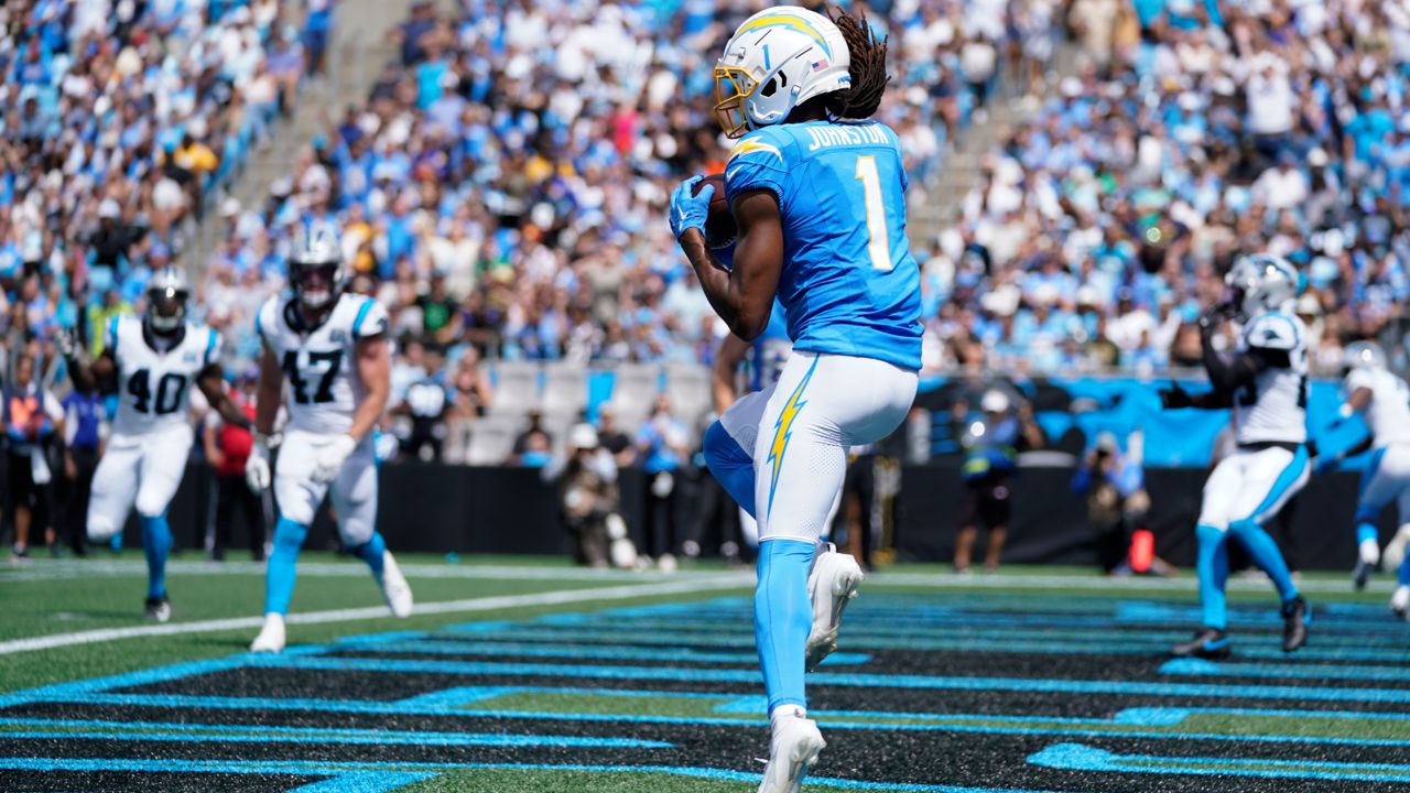 Los Angeles Chargers wide receiver Quentin Johnston scores during the first half of an NFL football game against the Carolina Panthers on Sunday, Sept. 15, 2024, in Charlotte, N.C. (AP Photo/Erik Verduzco)