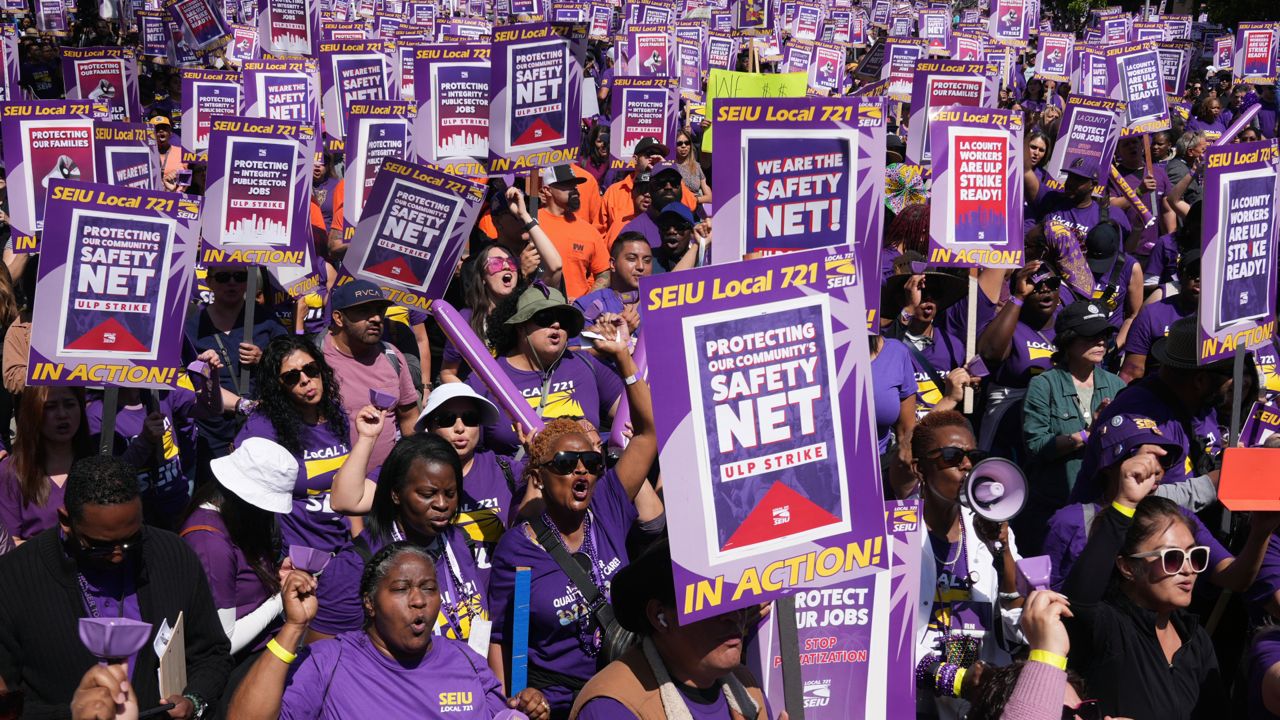 Los Angeles County workers rally to demand higher wages on Tuesday in LA. (AP Photo/Damian Dovarganes)