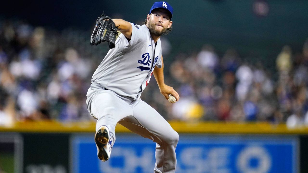 Los Angeles Dodgers starting pitcher Clayton Kershaw throws to an Arizona Diamondbacks batter during the first inning of Tuesday’s game in Phoenix. (AP Photo/Ross D. Franklin)