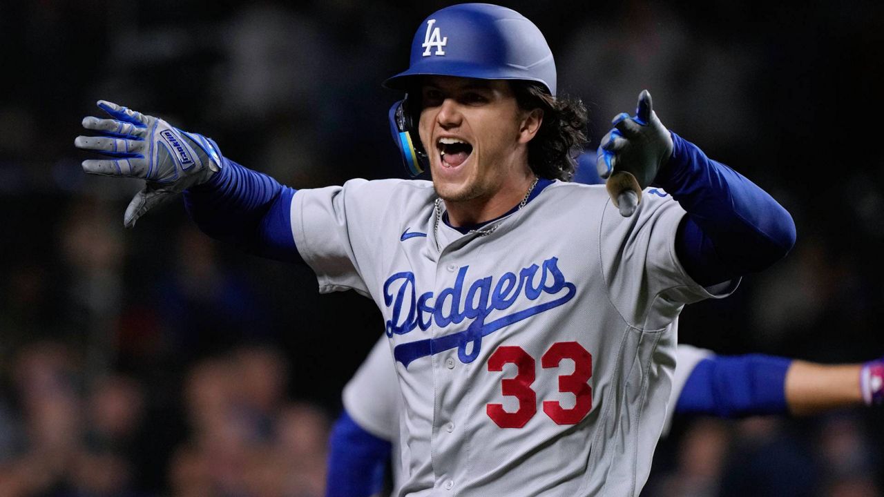 Los Angeles Dodgers' James Outman celebrates his grand slam against the Cubs during the ninth inning of a baseball game in Chicago on Thursday. (AP Photo/Nam Y. Huh)