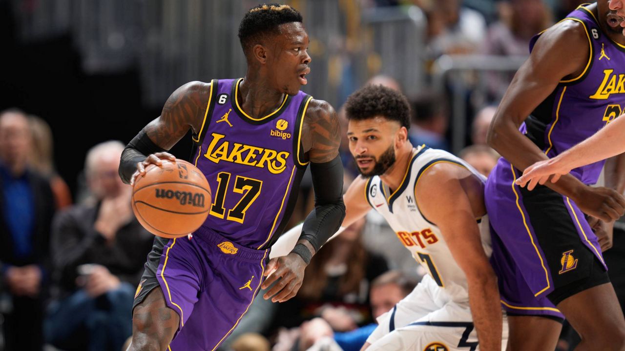 Los Angeles Lakers guard Dennis Schroder, left, drives to the basket past Nuggets guard Jamal Murray in the first half of Monday’s game in Denver. (AP Photo/David Zalubowski)