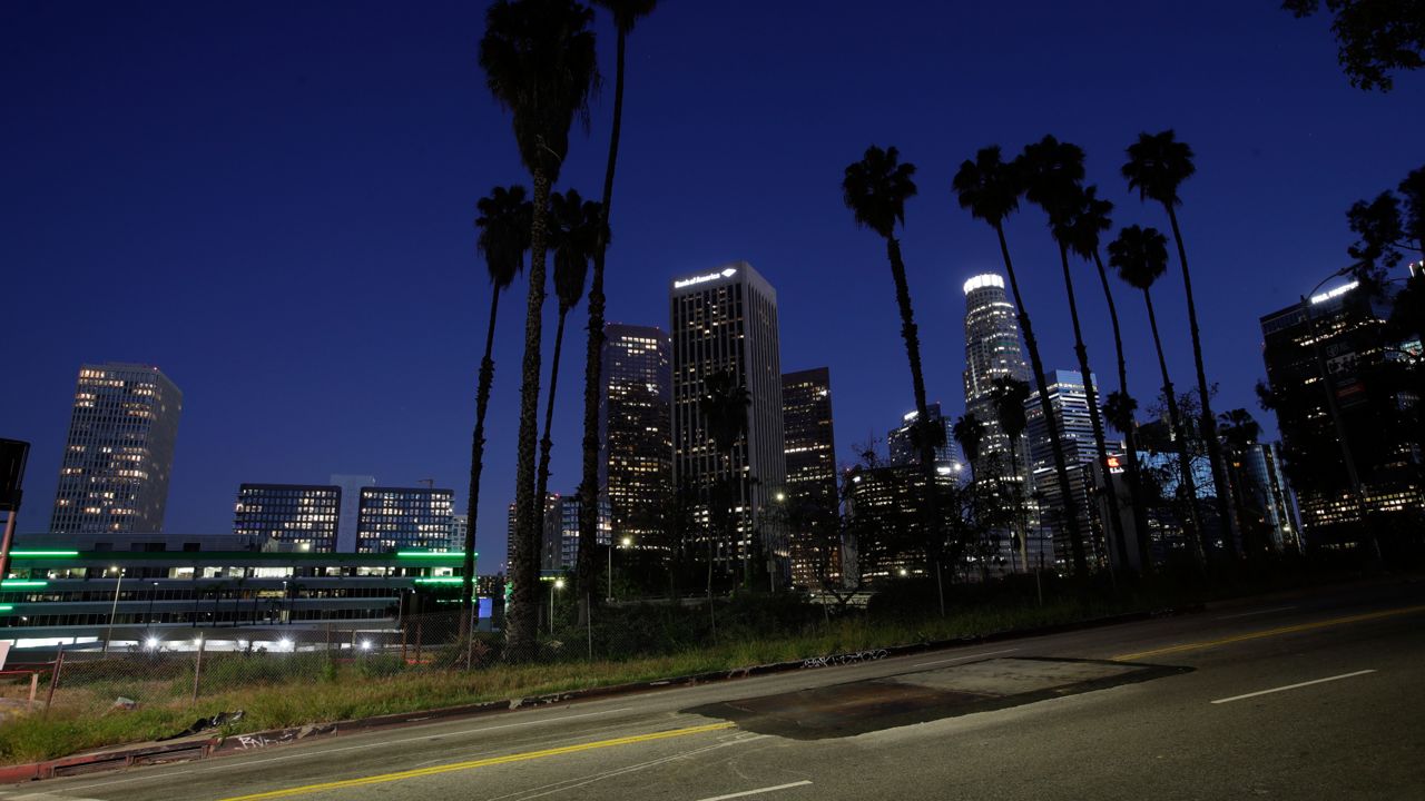 An empty street is seen in front of builidings in the downtown Los Angeles skyline Wednesday, April 1, 2020. (AP Photo/Marcio Jose Sanchez)