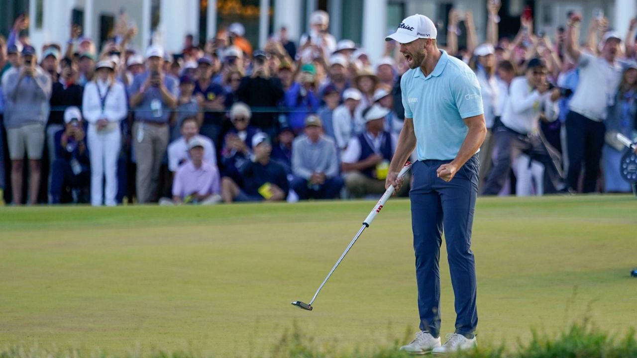 Wyndham Clark celebrates on the 18th hole after winning the U.S. Open golf tournament at Los Angeles Country Club on Sunday in LA. (AP Photo/George Walker IV)