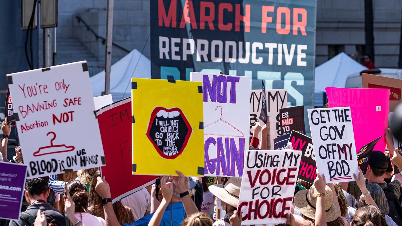 Abortion-rights protesters attend the "Bans Off Our Bodies Abortion Rally" at Los Angeles City Hall, Saturday, May 14, 2022. (AP Photo/Damian Dovarganes)