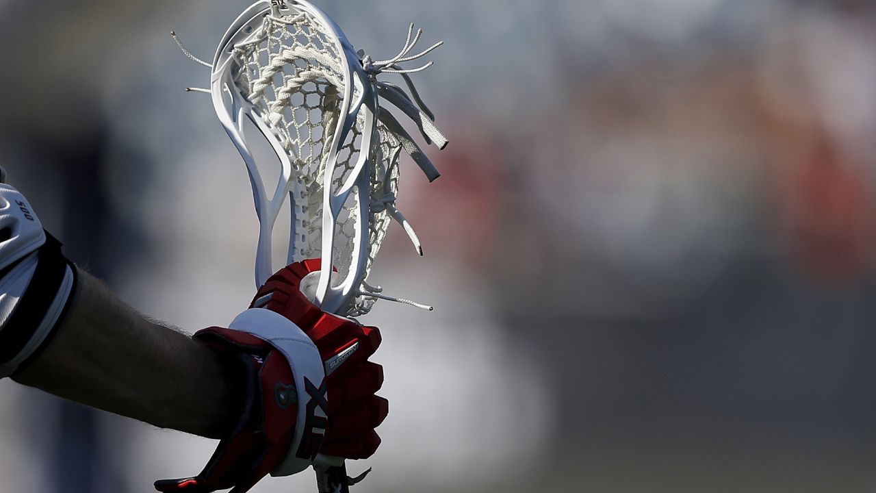 arm holding lacrosse stick