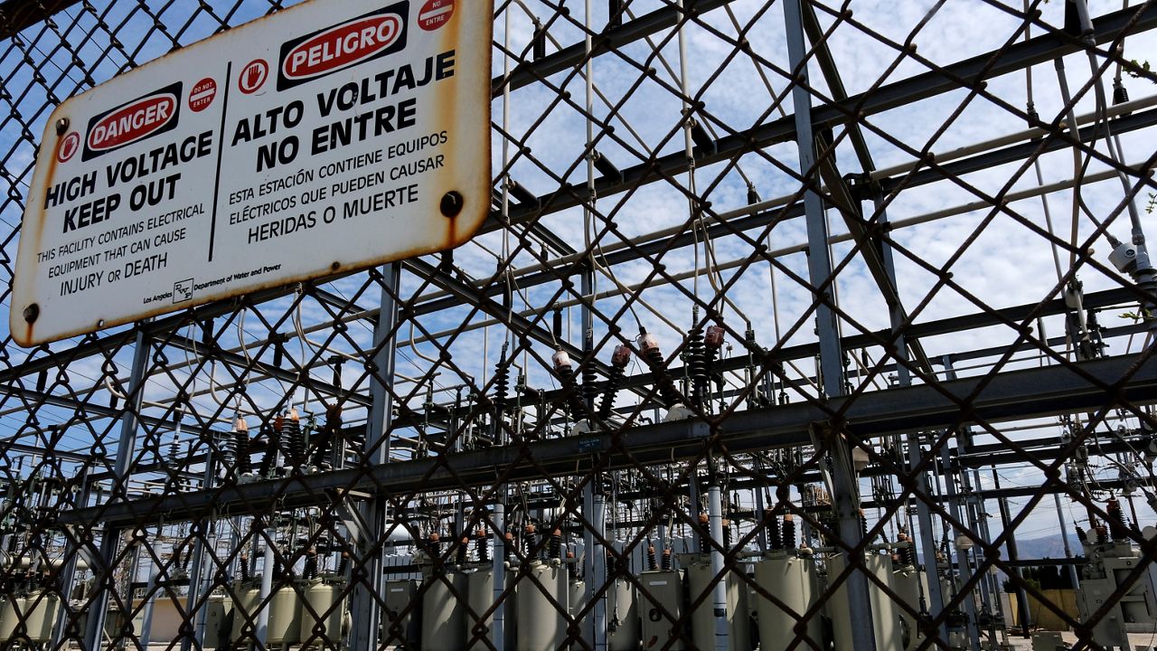 High voltage signs are posted on the Department of Water and Power sub station E in the North Hollywood section of Los Angeles on Saturday, Aug. 15, 2020.