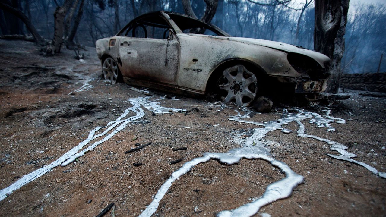 A burned vehicle is seen at a home destroyed by the Lake Hughes fire in Angeles National Forest on Thursday, Aug. 13, 2020, north of Santa Clarita, Calif. (AP Photo/Ringo H.W. Chiu)