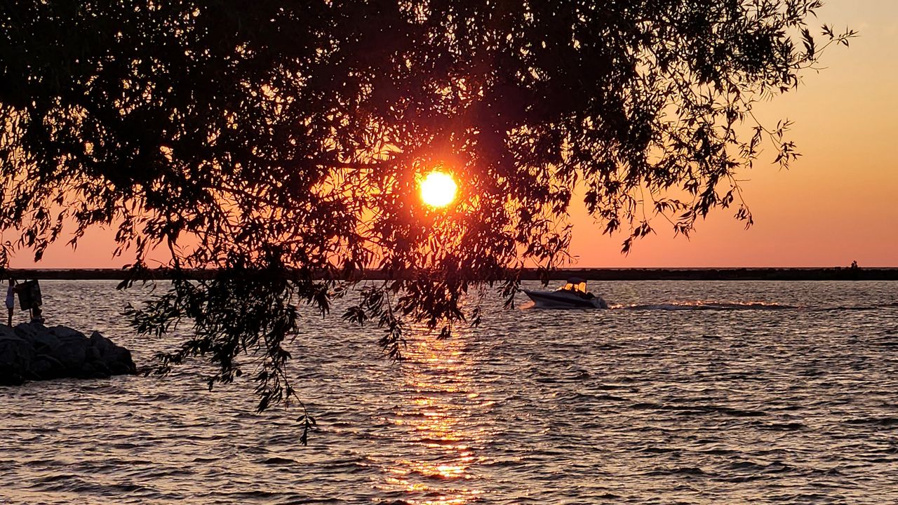 The sun sets over Lake Erie in Cleveland, Ohio on a summer evening. (Spectrum News 1/Lydia Taylor)