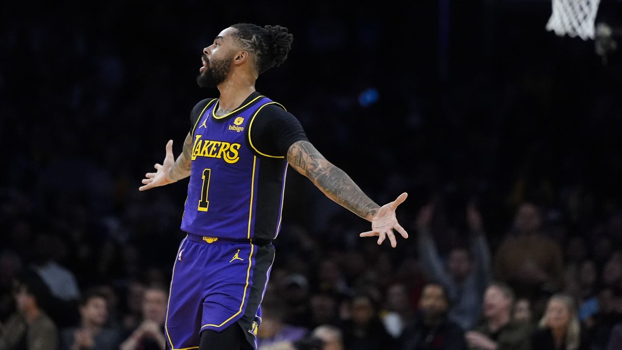 Los Angeles Lakers guard D'Angelo Russell celebrates after his 3-point basket during the first half of an NBA basketball game against the Milwaukee Bucks, Friday, March 8, 2024, in Los Angeles. (AP Photo/Jae C. Hong)