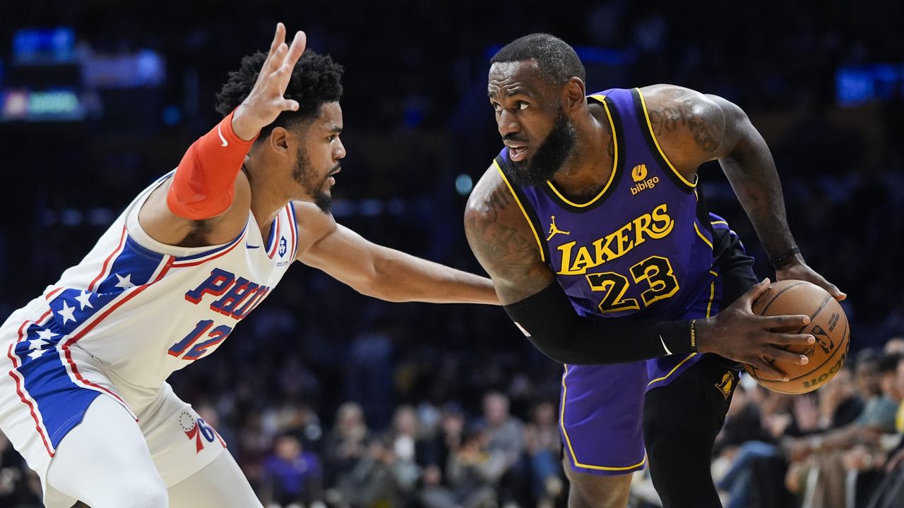 Philadelphia 76ers forward Tobias Harris (12) defends against Los Angeles Lakers forward LeBron James (23) during the first half of an NBA basketball game Friday, March 22, 2024, in Los Angeles. (AP Photo/Jae C. Hong)