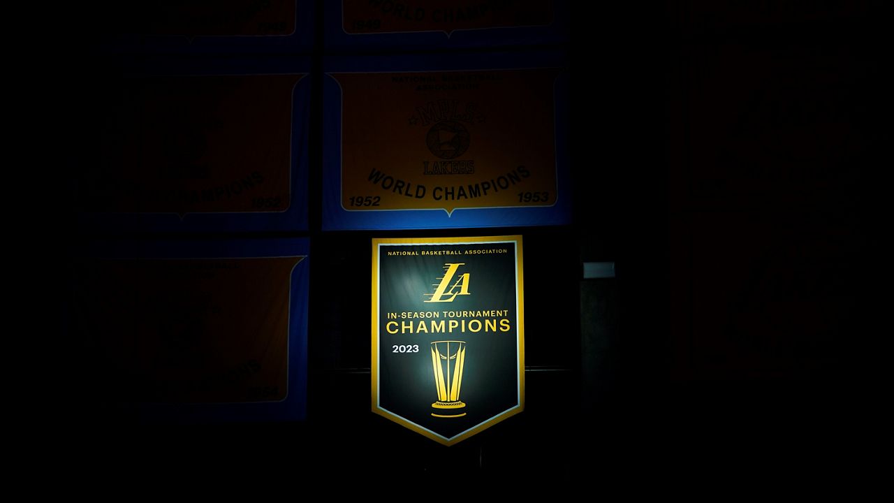 The 2023 NBA In-Season Tournament Champions banner is displayed before an NBA basketball game between the Los Angeles Lakers and the New York Knicks on Monday in Los Angeles. (AP Photo/Ryan Sun)