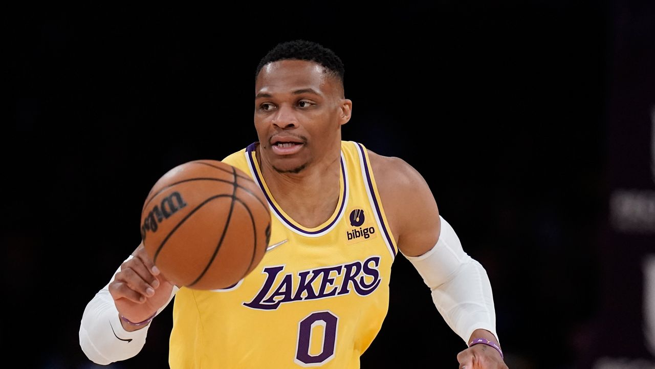 Los Angeles Lakers' Russell Westbrook dribbles during first half of an NBA basketball game against the Toronto Raptors Monday, March 14, 2022, in Los Angeles. (AP Photo/Jae C. Hong)