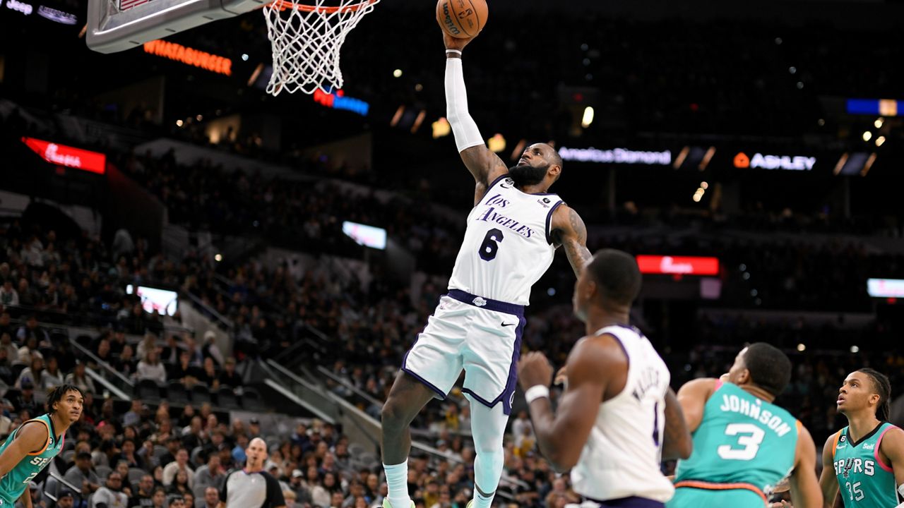 Los Angeles Lakers' LeBron James (6) goes to the basket during the second half of the team's NBA basketball game against the San Antonio Spurs, Friday, Nov. 25, 2022, in San Antonio. (AP Photo/Darren Abate)