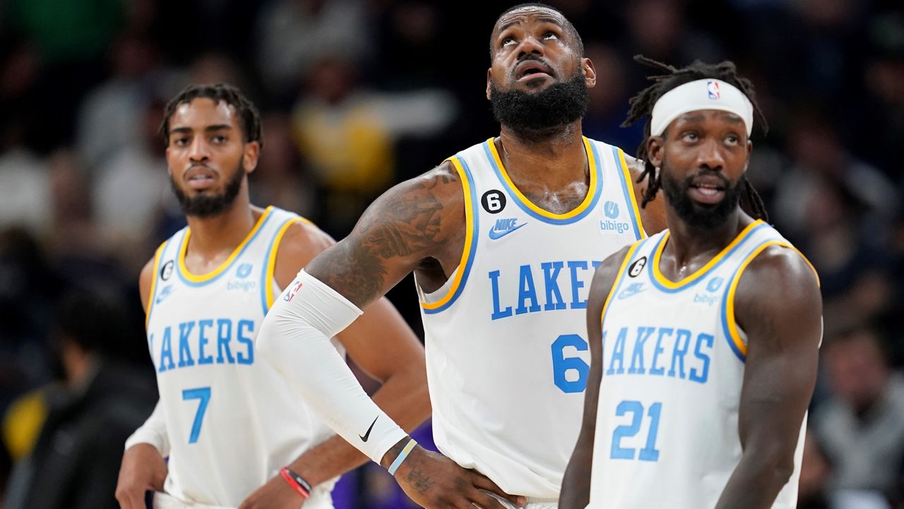 Los Angeles Lakers forward Troy Brown Jr. (7), forward LeBron James (6) and guard Patrick Beverley (21) look downcourt during the first half of an NBA basketball game against the Minnesota Timberwolves, Friday, Oct. 28, 2022, in Minneapolis. (AP Photo/Abbie Parr)