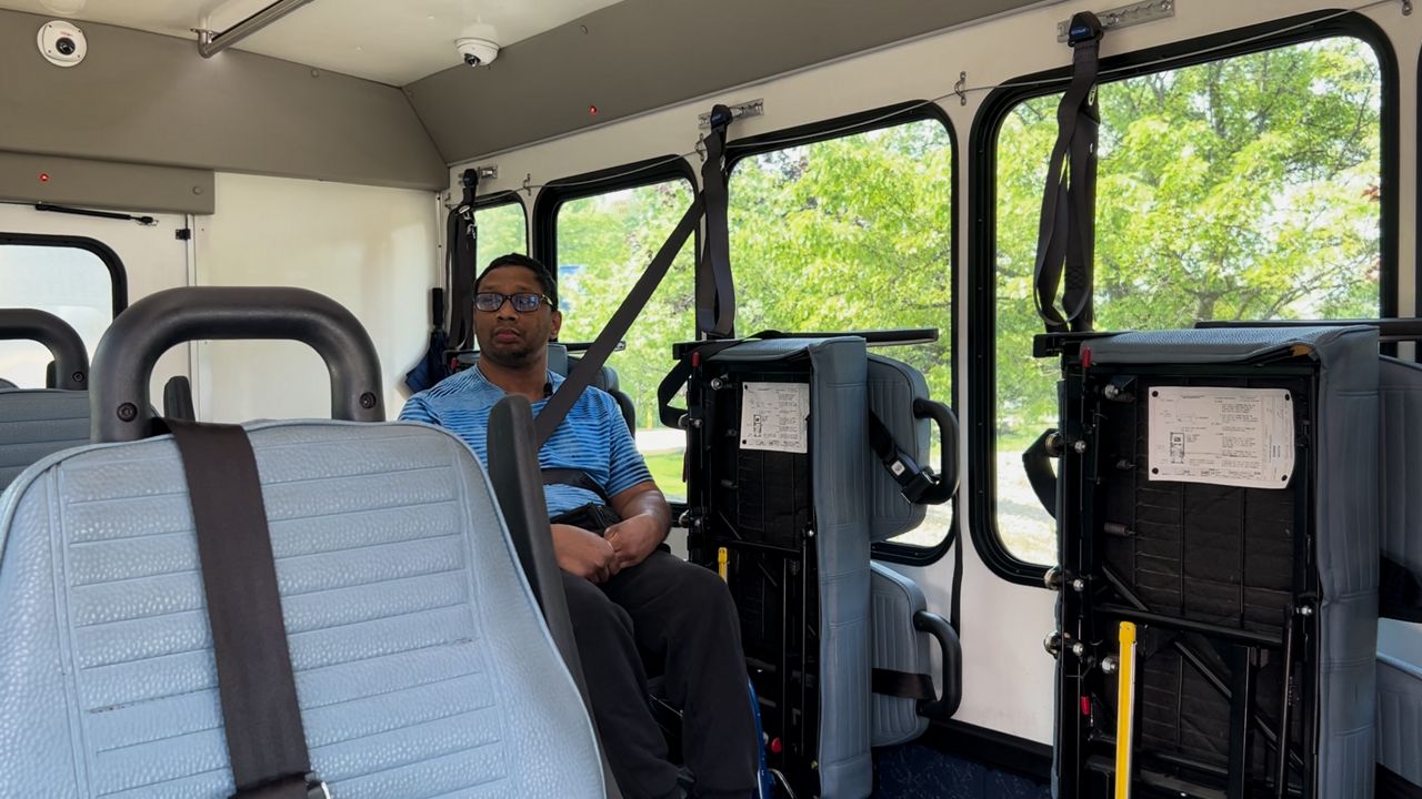 Andrew Vogt riding the Laketran that he booked using Rides on Demand.