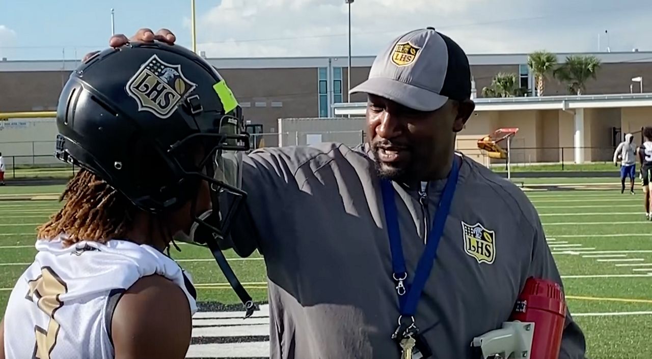 Lakewood's Coach Moore has the NFL bling