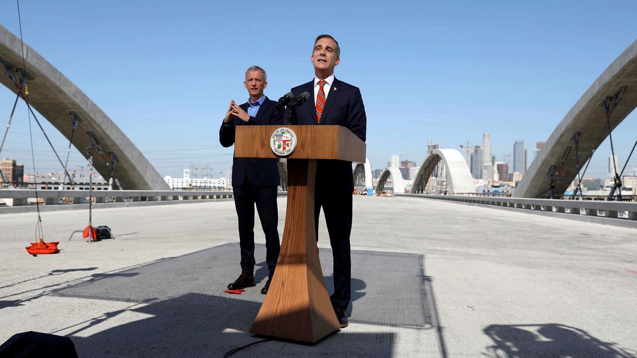 Los Angeles Mayor Eric Garcetti delivers State of the City Address from the under-construction Sixth Street Viaduct on Thursday, April 14, 2022, in Los Angeles. (Gary Coronado/Los Angeles Times via AP, Pool)