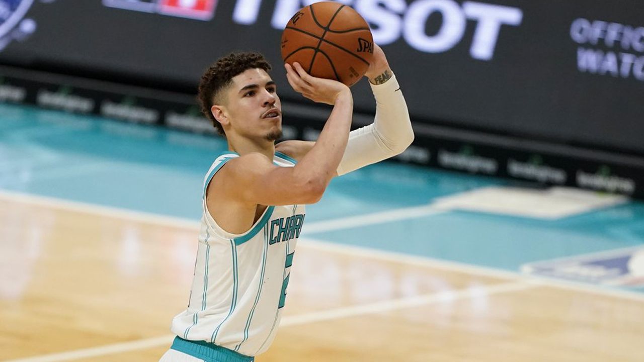 Charlotte Hornets guard LaMelo Ball (1) brings the ball up court